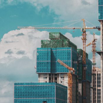 Crane doing construction work on high rise buildings