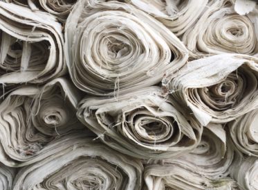 Rolls of white fabric stacked