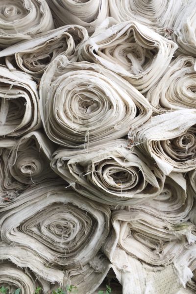 Rolls of white fabric stacked