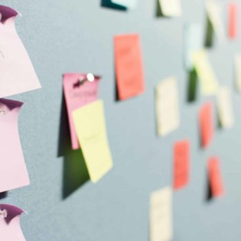 Wall with sticky notes pinned