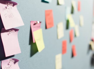 Wall with sticky notes pinned