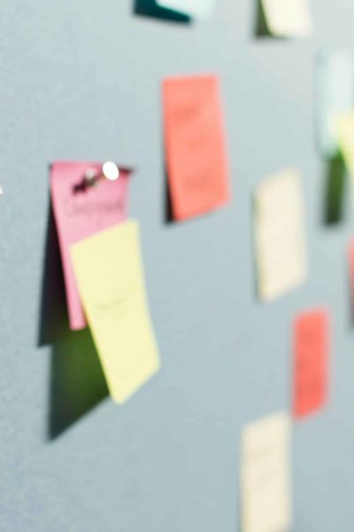 Wall with sticky notes pinned