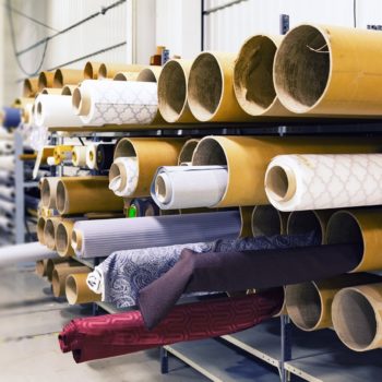 Rolls of fabric in a warehouse