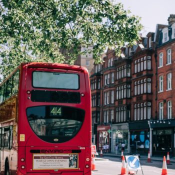 Red London double decker bus on a street