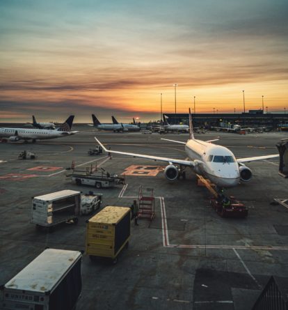 commercial aircraft on the tarmac outside airport