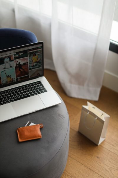 Laptop resting on a chair.
