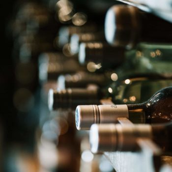 Stack of wine bottles on a shelf