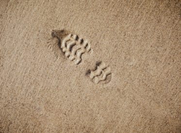 Shoe footprint in the sand
